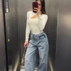 Jeans a vita bassa con tasca cuori